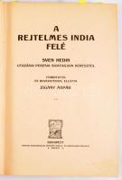Hedin, Sven: A rejtelmes India felé. Sven Hedin utazása Perzsia sivatagjain keresztül. Ford. és bevezetéssel ellátta Zigány Árpád. I-II. kötet. [Teljes.] Bp.,[1914]. Magyar Kereskedelmi Közlöny, (Tolnai Világlapja-ny.) 1 (címkép) t.+568+8 p.; 554+6 p. + 3 t. (színes). Egyetlen magyar kiadás. Sven Hedin (1865-1952) svéd felfedező, térképész, orientalista, utazási író, ismeretterjesztő és illusztrátor. Ifjúkorában a Kaszpi-tenger mellékén, Bakuban házitanítóskodott, a következő évben, 1886-ban utazta be először Perzsiát és Afganisztánt. Három, nagyobb ázsiai felfedezőútja a Selyemút, Tibet és a Transz Himalája feltárását célozta. 1893-1897 közti első expedíciója a sivatagos ujgur területeken át vezetett, 1899-1902 közötti második felfedezőútján Közép-Ázsiából érte el Tibetet, harmadik, 1905-1908 közötti harmadik expedícióján Perzsia sivatagi vidékei felől kísérelte meg feltérképezni Tibet délnyugati előterét. Szöveg-összeállításunk döntően a harmadik, perzsa-tibeti út néprajzi megfigyelésekben, népjellemtani és politikai kommentárokban gazdag beszámolóján alapul, oldalszámozáson belül igen gazdag szövegközti és egész oldalas illusztrációs anyaggal, köztük a szerző saját készítésű rajzaival. Úti beszámolója a Kaukázus országaiból indul, Perzsia központi régióin és keleti sivatagjain keresztül érkezik afgán, majd pakisztáni területekre, végül a tibeti buddhizmus déli régiójának, Kasmírnak érintésével tér vissza Pakisztánba. Egységes kiadói díszes, festett, aranyozott, illusztrált, vaknyomásos egészvászon-kötésekben, kopott borítókkal, sérült gerincekkel.