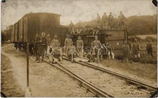 Osztrák-magyar katonák felborult vasúti kocsi mellett, kerékpár / Austro-Hungarian K.u.k. soldiers with an overturned wagon, railway, bicycle. photo (ragasztónyomok / glue marks)
