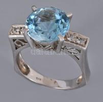 Ezüst (Ag) gyűrű kék topázzal, m:55, jelzett, bruttó 4,8g