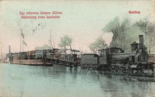 Gombos placing a locomotive onto a barge