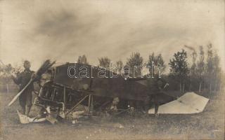 Hungarian pilots by a damaged plane photo