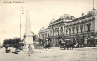 Szolnok Kossuth tér Városháza Koppán György vaskereskedésével, illetve Fehér Adolf és Komáromi József üzleteivel
