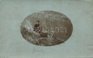 Priest hunting in boat photo