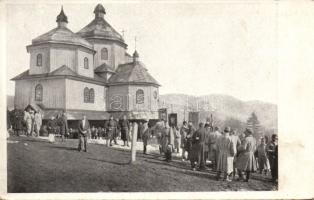 Military WWI Hungarian soldiers by a wooden church in the Carpathian Mountains