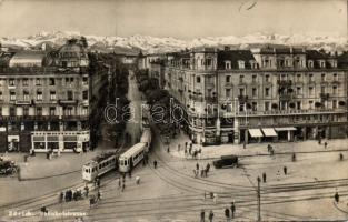 Zürich Railway street with trams and Hotel National Schweizerhof Terminus