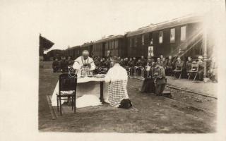 Military railway station, mass with soldiers photo