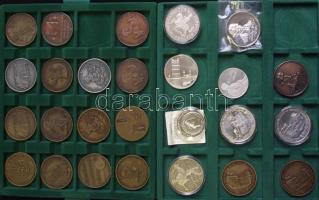 46db-ból álló emlékérem gyűjtemény kivehető tálcás éremtartó dobozban, köztük Ag és Br párok: "Magyar Éremgyűjtők Egyesülete" 1981. "MÉE Sárospatak-Perényi Péter, Lórántffy Zsuzsanna" Br (3x) és Ag emlékérem (34,7g) + 1982. "MÉE-Marcus Aurelius" érempár (3x) matt Br + Ag 34,77g + 1986. "MÉE-Buda visszafoglalása" Br + Ff érempár + 1985. MÉE-Deák Ferenc-Zalaegerszeg Br és Ag emlékérem pár (2x) + 1983. "MÉE-Madách" pár (2x) matt Br + Ag 34,7g + 1989. "MÉE-Kazinczy Ferenc" pár fényes Br + Ag 35,41g T:PP + 1990. "Magyar Köztársaság MÉE" érempár Br + Ag 35,9g T:1,PP + 1979. "MÉE - I. István dénára" matt Br emlékérem + 1983. Szécsény visszafoglalása emlékére Br és Ffém emlékérem pár + 1985. "MÉE - Thököly Imre" matt Br emlékérem + 1985. "60éves az Éremgyűjtők Hajdú-Bihar megyei szervezete-Apafi Mihály erdélyi fejedelem" Br emlékérem szign.:Tóth S. + 1982. "Magyar Éremgyűjtők Szombathelyi Csoportja - Kőszeg" Br emlékérem + 1984. "MÉE - Gyöngyös alapításának 650. évfordulójára" Br + Ag emlékérem 41g pár (2x) + 1987. "MÉE-Bessenyei György" Ag 35,7g és Br emlékérem pár T:PP,1 + 1982. "MÉE-Hajdú-Bihar Megyei Csoportja-Bocskai" matt Br emlékérem + 1985. "MÉE-Zalaegerszeg" Br emlékérem + 1980. "MÉE - Keszthely" Br emlékérem + 1984. "MÉE-Gyöngyös 650 éves-Róbert Károly" matt Br és Ffém emlékérem pár + 1991. Széchényi születésének 200. évfordulójára kiadott 2db "Lánchíd" + "M.T.A." Br emlékérem szign.:Bozó + 1986. "Magyar Hitelbank - Széchenyi István" Br emlékérem + DN "Gyulai Várszínház" Br emlékérem szign.:L.A. + 1990. "Magyar Külkereskedelmi Bank" ezüst 36,2gr szign:Lebó F. T:PP + DN "A magyar nemzet pénzérméi - Az első magyar feliratú pénz" Ag emlékérem 10g Tanúsítvánnyal T:PP + "Bartók Béla-A kékszakállú herceg Vára" ezüst 23,6g T:PP + 1970. "Budapesti Éremgyűjtők Vándorgyűlése Debrecen Ag emlékérem 22,55g T:PP + 1999. "30 éves a Magyar Éremgyűjtők Egyesülete-Szent László" Ag (925) piefort (67,5g) emlékérem névre szólóan gravírozva T:PP