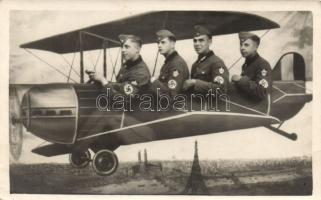 Military WWII German soldiers posing in an aeroplane