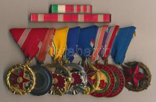 8db szocialista kitüntetés együtt felfüggesztve, közte 1964. "Kiváló Szolgálatért Érdemérem", "Haza Szolgálatáért ezüst/arany" , "Közbiztonsági Érdemérem arany/bronz", 1957. "Szolgálati Érdemérem", "Szolgálati Érdemérem 20-30 év után" + szalagsáv (műanyag)
