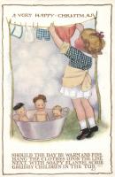 Christmas, little girl play with her dolls