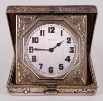 cca 1920 Elgin utazóóra "Illinois W.C.Co. Elgin Sterling" jelzésű, részben aranyozott sterling ezüst (Ag) tokban, vésett növényi ornamentikával, fedelén festett zománcozott díszítéssel. Szép állapotú, az óra jól jár /  Elgin travel watch in sterling silver case with floral ornament, and enamel decoration on lid, gold plating inside, hallmarked "Illinois W.C.Co. Elgin Sterling". Watch works well, alltogether in nice condition, 6,5x6,5cm, br: 169,5gr