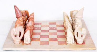 Kézzel faragott komplett kő sakk-készlet táblával (egy-két darab javítva) /  Hand carved stone chess set, complete (some repaired)