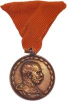 1911. "Díszérem a Tűzoltás és Mentés Terén Teljesített 25 Évi Eredményes Tevékenységért" kitüntetés narancssárga mellszalagon, KB verdejellel. Szign.: REISNER T:1- Hungary 1911. "Medal of Honour for Fire Service and Life-Saving" decoration on orange ribbon with K.B. (Kremnitz) mint mark. Sign: REISNER C:AU