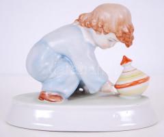 Búgócsigázó kisfiú, kézzel festett jelzett Zsolnay porcelán figura /  Playing boy, hand painted porcelain figure, 15x12x8cm