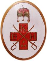 ~1940. "K B H" Vöröskeresztes zománcozott aranyozott ovális Br jelvény E: fehér zománcozott alapon színes Szent Korona felül, alatta vörös kereszt, a szárakon K-B-H betűk és három pont, kereszt előtt keresztbe tett kard, H: kitűző és MORZSÁNYI J. BUDAPEST (38x48mm) T:2 Hungary ~1940. Red Cross enamelled Br oval badge with the letters "K B H", the crown of Hungary and a red cross with two swords (38x48mm), maker: Morzsányi firm C:XF Huszár-Medicina In Nummis 1108.
