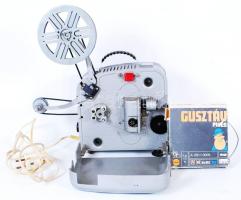 Lomo 8mm-es vetítőgép 2 tekercs Gusztáv rajzfilmmel (tisztításra szorul) /  Lomo 8mm projectior with 2 tape reels of a Hungarian cartoon (needs repair), 20x20x15cm