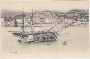 An overturned ship in Menton port
