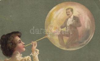 Lady blowing a bubble in which there is a man. litho (b)