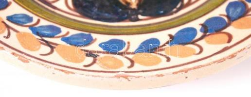 Jelzés nélküli, kézzel festett, népi kerámia, fali dísztányér. Apró mázhibákkal. d: 19cm