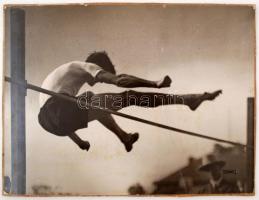 1922 Kerny István: (1897-1963): Magasugró, vintage alkotás. Pecséttel jelzett. Kartonon, hibával. /  1922: High-jumper. Vintage photo with fault. On cartboard. 30x40 cm