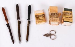 cca 1920 Cigarettaszett: 3db cigarettatöltő, 2 csomag eredeti, Austria Tabakwerke A.G. cigarettapapír és egy szivarvágó /  Little smoking set: 3 cigarette fillers, original Austrian cigarette papers and a cigar cutter