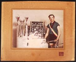 cca 1920-1940 Kerékpáros versenyző az érmeivel a csepeli Fehér Fotótól. Hibás, egy részén lekopott az emulzió, kézzel színezett, 17x23/27x34cm
