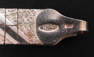 Ezüst (Ag) karkötő két oldalán eltérő díszítéssel, jelzett, h: 18 cm, 11 g /
Silver bracelet, 11 g