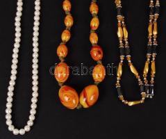 Bizsu tétel, benne főként borostyán színű 3 db nyaklánc (ebből 1 db mágneses), fülbevaló, kitűző, me...