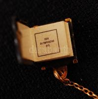 Olimpia mikrokönyv, olimpiai eskü szövegével, díszdobozban, aranyozott fém tartóban, rajta 14K arany...