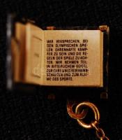 Olimpia mikrokönyv, olimpiai eskü szövegével, díszdobozban, aranyozott fém tartóban, rajta 14K arany...