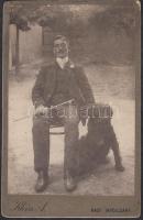 cca 1910 Felvidék, Nagy-Tapolcsány, kutyus a gazdával, Klein A. szabadtéri felvétele, keményhátú kabinet fotó, hátoldaláról hiányzik a díszítő grafika, 16x10 cm