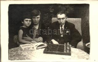 Family with chess board photo (pinhole)