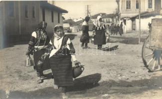 Romanian folklore, women carrying water photo