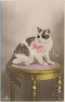 Cat with button eye and textile bow